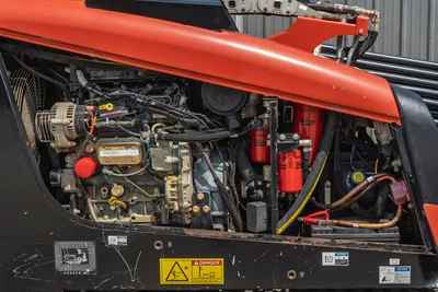 2018 Ditch Witch JT10 horizontal directional drill engine compartment with clean, well-maintained components and red filters.