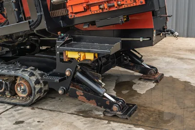 2012 Ditch Witch JT3020 MACH 1 HDD drill stabilizers, steel tracks, and carriage frame detail, side-angle view.