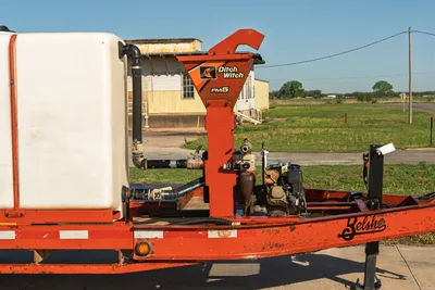 Side view 2016 Belshe WB14-2EP trailer with 2020 Ditch Witch FM5x mixing system, white tank, controls.
