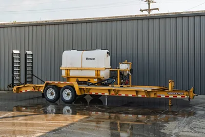 2021 TowMaster T-20D yellow flatbed trailer with Vermeer water tank, mud mixing system, dual axle, and pipe rack