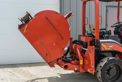 2017 Ditch Witch RT80 side view showing rear-mounted trencher attachment, hydraulic lift assembly, and wheel carriage.
