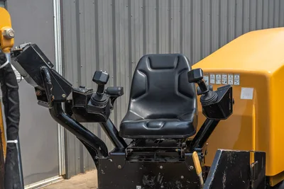 2014 Vermeer 24x40 Series II operator station featuring ergonomic seat, dual joystick controls, and engine compartment cover.