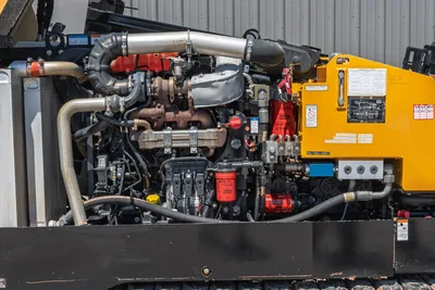 2019 Vermeer D40x55 S3 open engine compartment showing diesel engine, turbo, hydraulic pumps, filters, and service decals