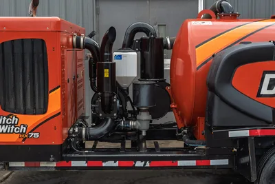 2023 Ditch Witch HX75 mud recycler, side view showing pump assembly, mud filtration system, and plumbing between power unit and tank