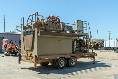 2018 Mud Technologies MCT-450 trailer-mounted mud recycler, rear 3/4 view, tan finish, upper deck with shaker, engine, tandem axle