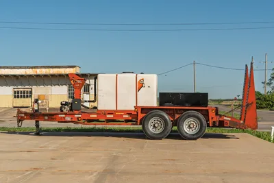 2016 Belshe WB14-2EP trailer, orange frame, white Ditch Witch FM5x mixing system, tandem axle.