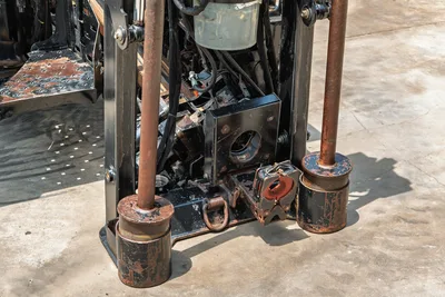 2017 Ditch Witch JT20 drill frame close-up showing wear-worn drill pipe, vise assembly, and hydraulic components