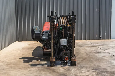 2021 Ditch Witch JT20 HDD drill, rear view showing drill pipe rack, carriage frame, hydraulics, operator seat, rubber tracks