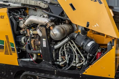 2016 Vermeer D23x30 S3 open engine compartment showing diesel engine, exhaust, hydraulic lines, and air filter