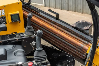 2018 Vermeer D8x12 drill pipe rack with used 1.66" HDD pipes, dual joystick controls, and LCD display panel