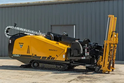 2022 Vermeer D23x30 S3 Navigator HDD drill, 3/4 view, yellow tracks, drill frame angled, pipe rack, operator seat visible