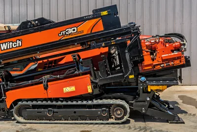 2016 Ditch Witch JT30 All Terrain HDD drill rig side profile showing tracks, drill carriage, and engine compartment assembly.