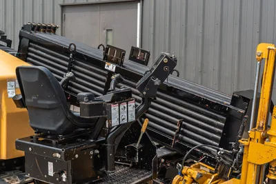 2014 Vermeer 24x40 Series II operator station with joystick controls, drill pipe rack, and hydraulic components in use.
