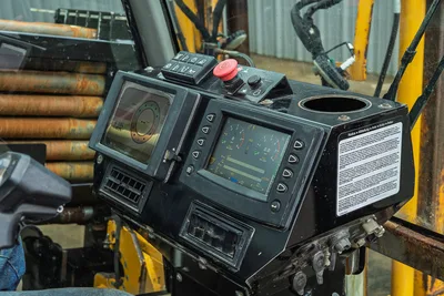 Operator console of 2017 Vermeer 40x55 S3 showing digital displays, control switches, and emergency stop button.