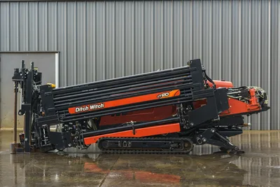 2015 Ditch Witch JT20 HDD drill, full side profile, drill pipe rack loaded, rubber tracks, anchor system, hydraulics visible