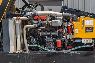 2021 Vermeer D24x40 S3 open engine compartment showing diesel engine, turbo, hydraulic power unit, oil filters, and cooling system