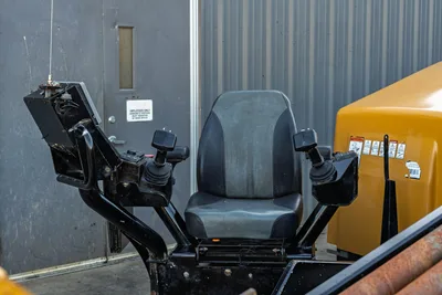 2019 Vermeer D40x55 S3 operator seat with dual joystick controls, display panel, and yellow engine hood visible