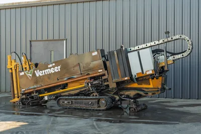 2021 Vermeer D23x30 S3 HDD rig, driver-side view, drill frame angled down, rubber tracks, hydraulic hoses, cable carrier visible