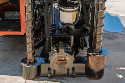Ditch Witch JT30 All Terrain carriage assembly, breakout wrench, and dual anchoring augers in detailed front perspective.