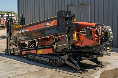 2018 Ditch Witch JT20 horizontal directional drill, side profile showing tracks, engine compartment, and drill pipe rack.