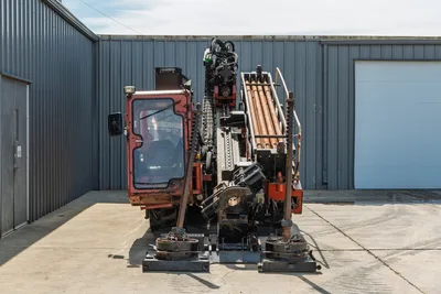 2014 Ditch Witch JT100 Mach 1 HDD drill, rear view, enclosed cab, loaded drill pipe rack, anchor systems, wear visible