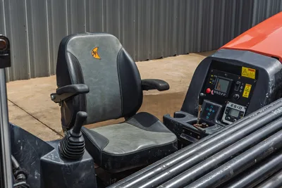2018 Ditch Witch JT10 operator seat with Ditch Witch logo, joystick controls, ESID display panel, and drill pipe rack visible