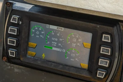 Vermeer 10x15 S3 control panel display showing PSI, RPM, and operational gauges with side button controls