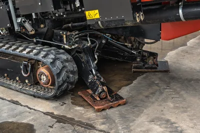 2024 Ditch Witch JT24 rubber track, hydraulic anchor system, and deployed ground anchor plate shown at low angle