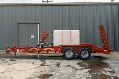 2019 Belshe WB14-2EP mud mixing trailer, full driver-side view, red frame, white poly tank, Ditch Witch mixer unit, tandem axle