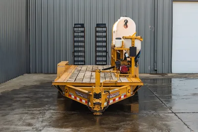 2021 TowMaster T-20D HDD trailer, rear view, wood deck, Vermeer MX125 mixer with white tank, gas engine, pipe racks visible