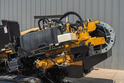 2020 Vermeer D24x40 S3 HDD drill rig carriage close-up showing hydraulic hoses, rotary drive, cable track, and fluid reservoir