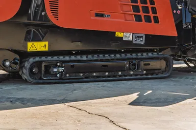 Side profile of 2023 Ditch Witch JT20 HDD showing clean black rubber tracks, hydraulic drive motors, and engine cowling.