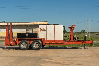 Side view of Belshe WB14-2EP trailer with Ditch Witch FM5 mixing system, white tank.