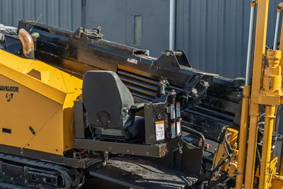 2016 Vermeer D23x30 S3 Navigator operator seat, drill frame, and pipe rack viewed from side angle