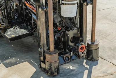 High-angle view of 2021 Ditch Witch JT20 drill pipe rack, anchor base system, and hydraulic components on HDD drill rig.