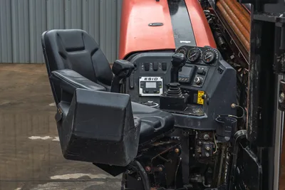 2018 Ditch Witch JT20 operator station featuring ESID controller, dual joystick controls, and black suspension seat.