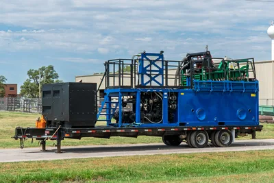 2023 American Augers M300DH mud recycling system on trailer, blue frame, black generator, green shaker deck, pump compartment, side profile view