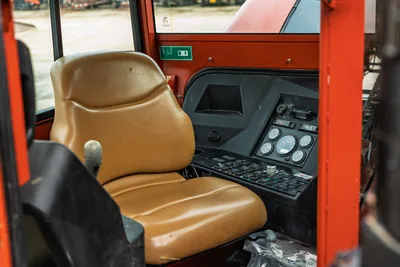Interior cab of 2012 Ditch Witch JT3020; shows operator seat, instrument gauges, and drilling control console panel.