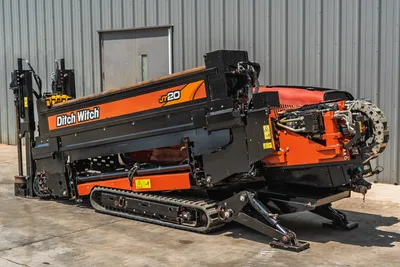 2021 Ditch Witch JT20 HDD drill, angled side view, rubber tracks, elevated drill frame, hydraulic chain drive, anchor system visible
