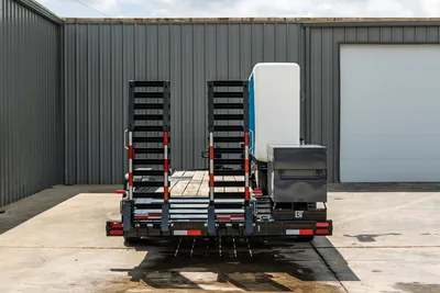2026 Behnke CBCT2324E-BT-R HDD trailer, rear view, dual fold-down ramps, wood deck, water tank, toolbox, red reflectors