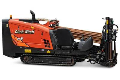 2016 Ditch Witch JT9 HDD drill, 3/4 profile, orange hood, rubber tracks, loaded drill pipe rack, operator seat, carriage assembly visible
