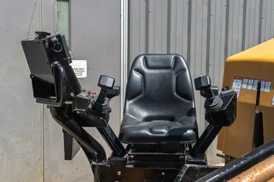 2020 Vermeer D24x40 S3 operator station with black seat, dual joystick controls, and display mount