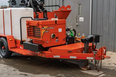 2015 Ditch Witch MR90 mud mixing trailer, front 3/4 view; FM25h mixer unit, hopper, water tank, hose connections, trailer hitch visible