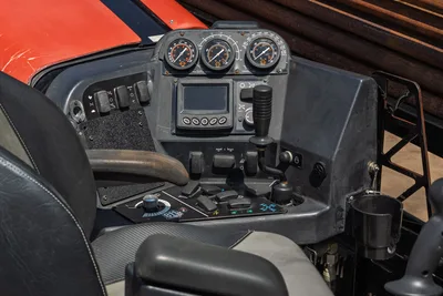 2022 Ditch Witch JT20 operator console showing thrust/pullback/torque gauges, joystick, toggle switches, and display panel