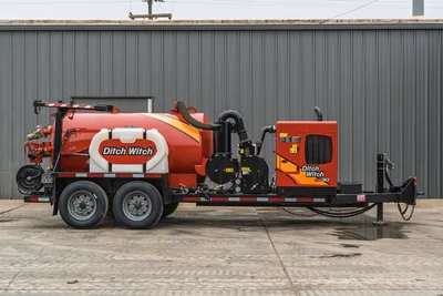 2019 Ditch Witch HX30 vacuum excavator side profile with trailer, debris tank, water tank, engine housing, and hoses.