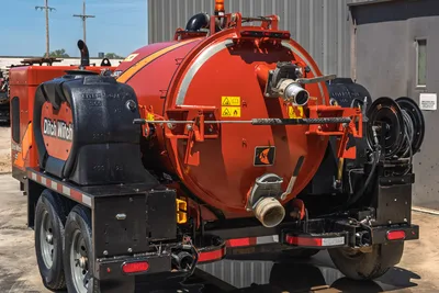2023 Ditch Witch HX30 mud mixing system, rear 3/4 view showing 300-gal tank, fill ports, hose reel, discharge manifold, trailer hitch