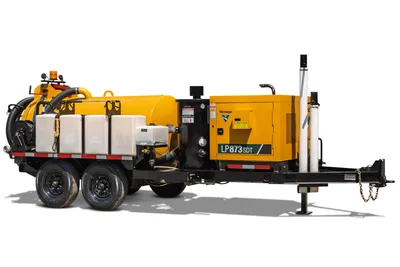 2025 Vermeer LP873SDT trailer-mounted vacuum excavator, 3/4 view, yellow debris tank, water tanks, suction hose, diesel power unit, tandem axle