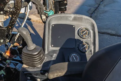 Ditch Witch JT10 control panel with joystick, pressure gauges, and digital display