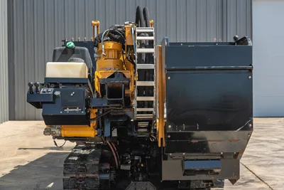 2020 Vermeer D24x40 S3 HDD drill, rear view showing vise assembly, carriage, hydraulic hoses, operator controls, and rubber tracks