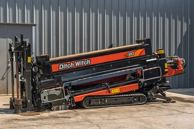 2022 Ditch Witch JT20 HDD drill angled in launch position, showing drill frame, rubber tracks, hydraulics, and drill pipe loaded